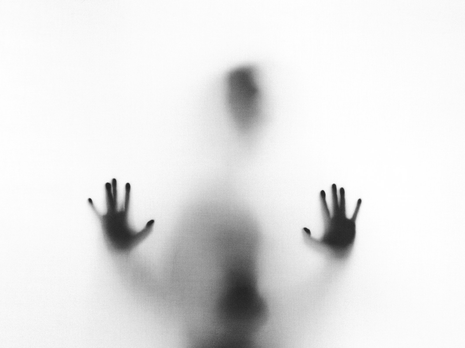 Photo by Stefano Pollio person behind fog glass